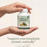 Lymphatic Support capsules — hands holding the 60-capsule bottle