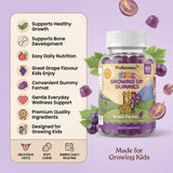 Kids Growing Up Gummies — product feature checklist beside bottle with grapes